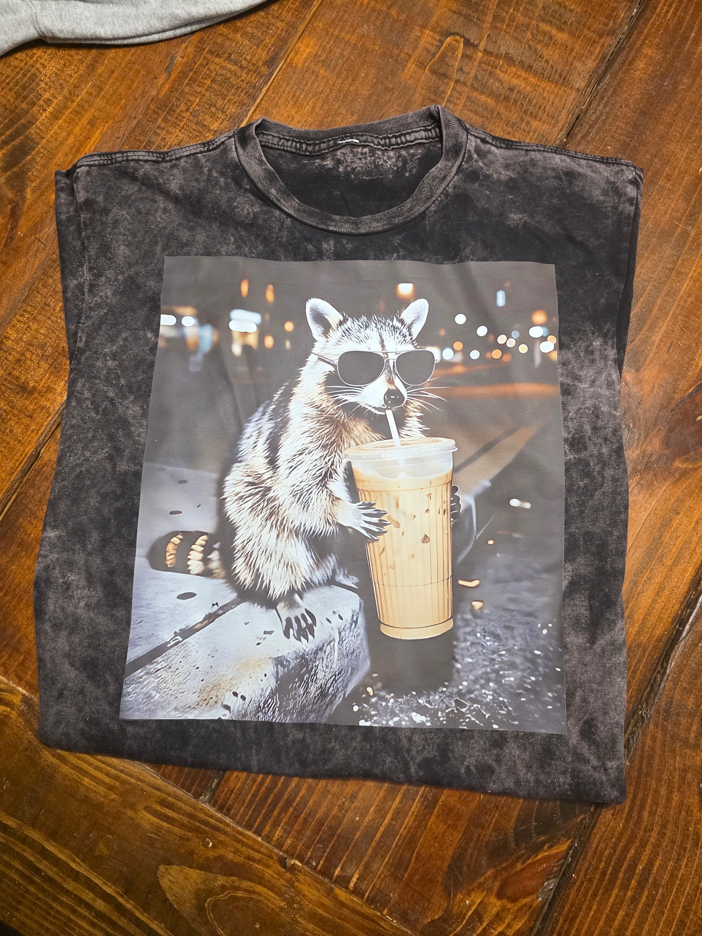 Raccon drinking coffee
